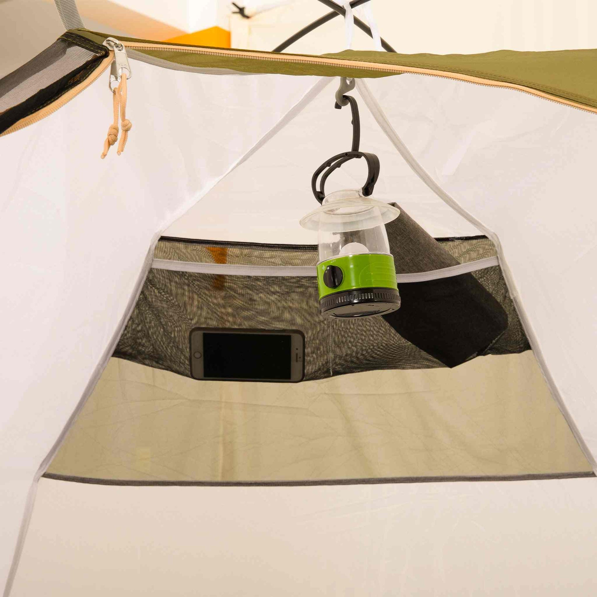 2 person waterproof festival tent interior with light hook and storage pockets.