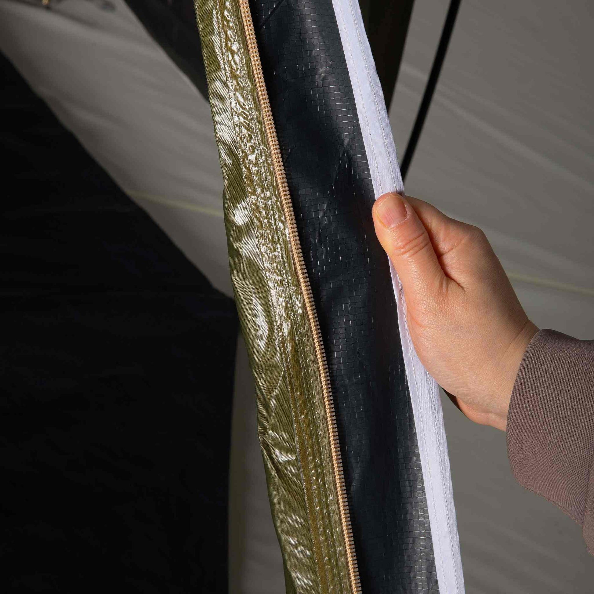 Close-up view of the Pico 2.0 Blackout tent's waterproof seam and zipper.