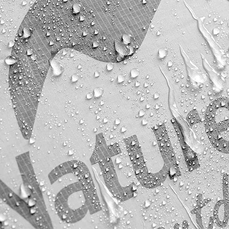 Close-up of water droplets on the fabric of an ultralight 2-person tent by Naturehike, showcasing its waterproof design.